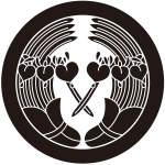 丸に変り抱き杜若紋